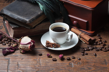 Cup of coffee, dry rose and old telephone