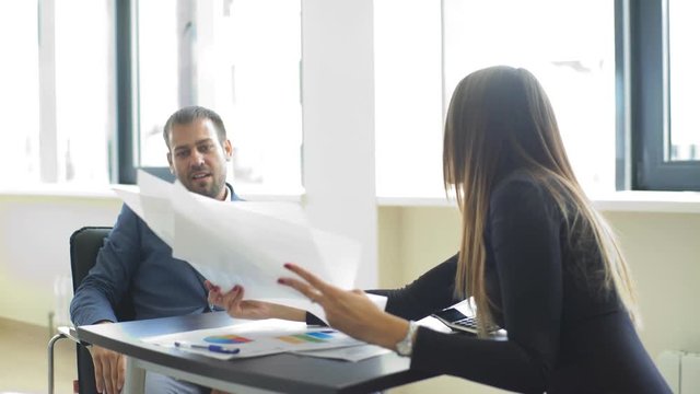 Angry business man screaming at employee in the office
