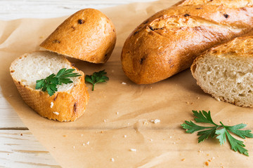 Sliced French Baguette on white rustic table