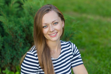 Fototapeta premium Portrait of a beautiful girl with long blond hair