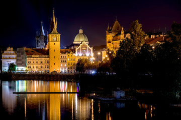 Fototapeta na wymiar Scenic night view of Charles Bridge and buildings along the Vltava river. Prague, Czech Republic