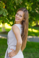 Portrait of a beautiful girl with long blond hair