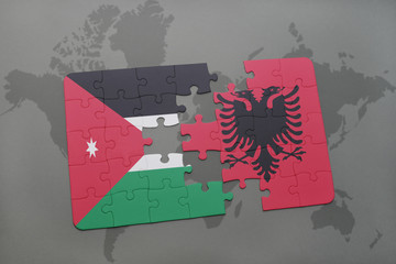 puzzle with the national flag of jordan and albania on a world map background.