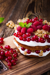 Berries butter layer cake with whipped cream topping
