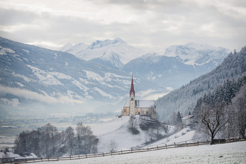 Church in alpine Zillertal valley in winter
