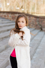 Portrait of beautiful girl with dark hair and brown eyes.