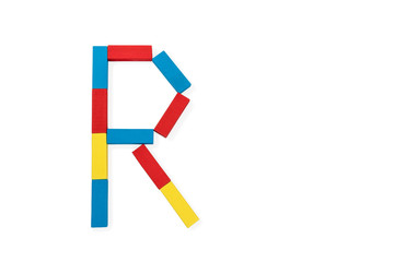 Letter R is folded of wooden blocks