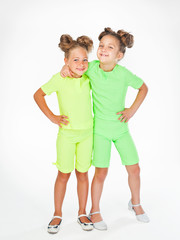 two little girls in similar fancy garb