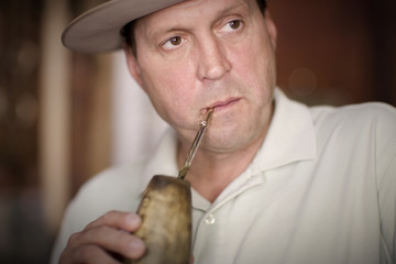 View of a thoughtful man drinking