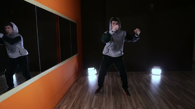 Hip-hop dancing in a Studio in front of a mirror
