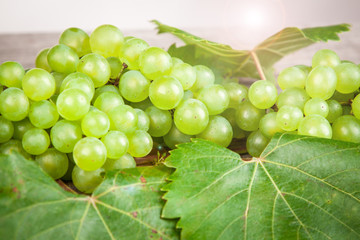 grapes, white wine on a wooden table
