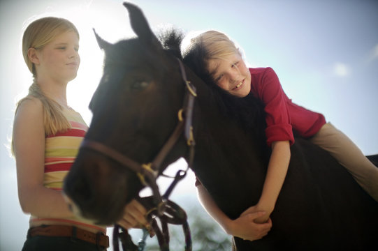 young girls with a horse