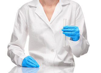 Female in gown and blue gloves holding empty test tube