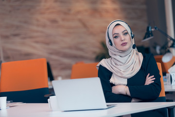 Beautiful phone operator arab woman working in startup office