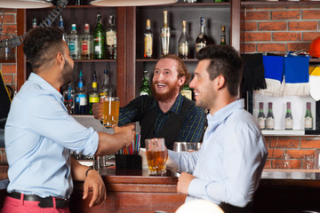 Two Man In Bar At Counter, Barman Giving Beer Glass, Friends Meeting Guys Cheerful Smiling