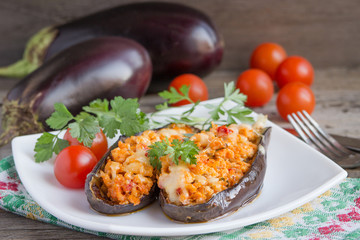 Baked stuffed eggplant with meat, vegetables and cheese.