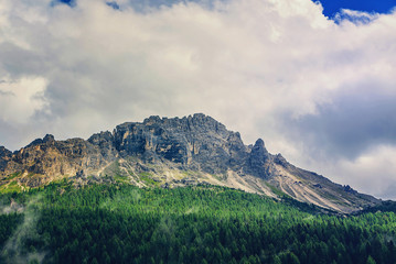 Obraz premium Mountain peaks in the clouds in Italy