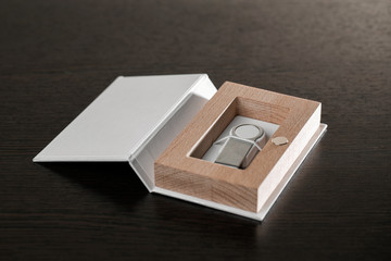 Packaging for USB drives. Handmade box. Wooden boxes on dark background