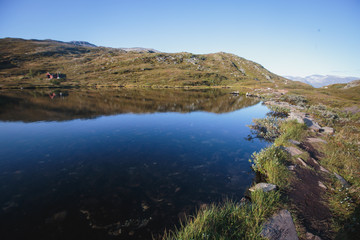 Fototapeta premium Hiking in Norway, classic norwegian scandinavian summer mountain norwegian landscape 