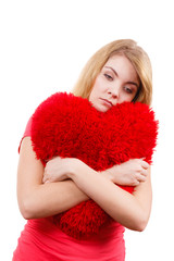 Woman sad girl hugging red heart love symbol