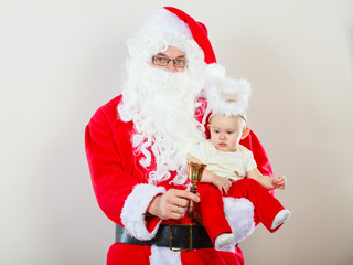 Santa claus with little baby.