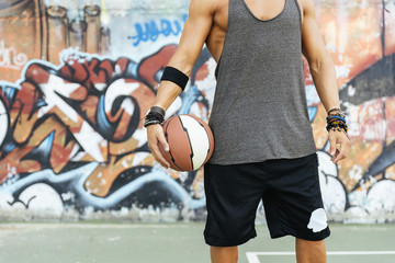 Man holding basket ball.