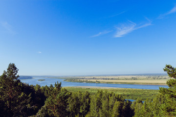 Aerial view the river on green forest plain..