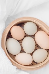 Fresh chicken eggs in basket