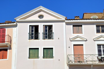 Classic French Provencal architecture with shutters and balcony