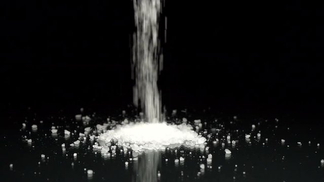 Rock Salt Crystals Being Poured Slow Motion