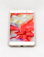 Modern smartphone displaying full screen picture of Christmas gi
