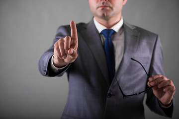 Businessman pressing buttons in business concept