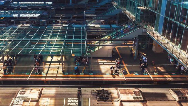 Time-lapse of trains and commuters inside Osaka Station in Osaka, Japan. 