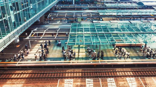Time-lapse of trains and commuters inside Osaka Station in Osaka, Japan. 