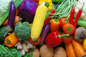 Many fresh vegetables as background, assortment of raw vegetables close up