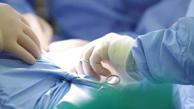 Surgeon's hands - CU

(Filmed in ProRes with high dynamic range for flexibility for image grading)