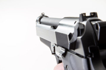 9mm Handgun on a white background.