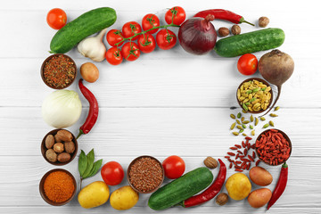 Vegetables and spices on wooden table