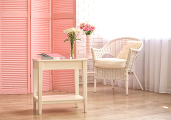 Light room interior with pink folding screen