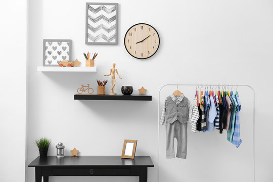 Shelves with hanger in modern baby room