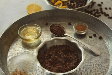 Natural scrub of sugar, olive oil and coffee on silver tray