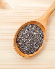 Nutritious chia seeds in wooden spoon for diet food ingredients
