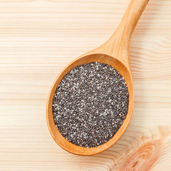 Nutritious chia seeds in wooden spoon for diet food ingredients