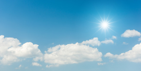 Obraz na płótnie Canvas Blue sky with clouds and sun reflection