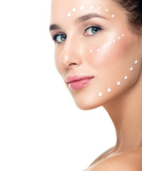 Fototapeta premium Beautiful Young Woman applying facial moisturizing cream.Skincar