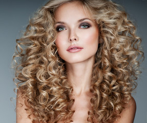 Beautiful blonde woman. Healthy Long Blond Hair. Curly Hair.   B - 121190523
