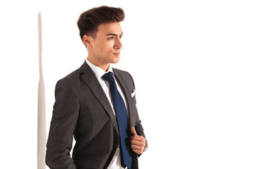 side view of a young business man holding collar