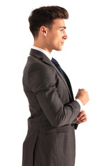 profile picture of a young business man fixing his sleeve