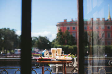 breakfast on the balcony overlooking the city of St. Petersburg