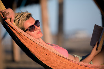 relaxed woman laying in hammock